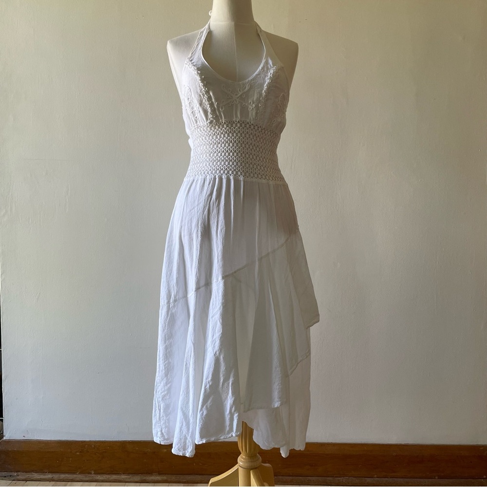 Breezy white cotton 70s dress with asymmetrical hem